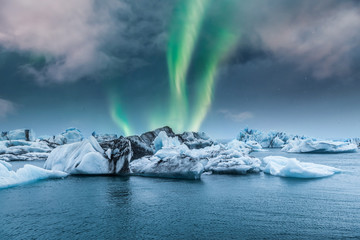 Northern light aurora borealis over glaciers.  