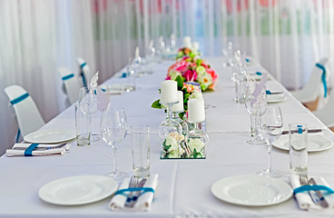 Served tables in restaurants and cafes, meals and drinks on the tables, room design.