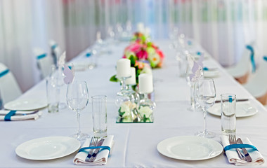 Served tables in restaurants and cafes, meals and drinks on the tables, room design.