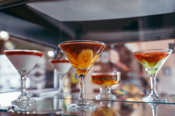 Jelly with fresh berries in a showcase