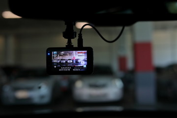 video camera recorder inside vehicle in car park