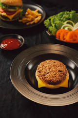 Fresh Tasty burger on dish with with french fries, ketchup