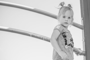 Concept of children life. Little child having fun in a beach. Happy child playing in the nature . Kid having fun outdoors. Summer vacation and healthy lifestyle 