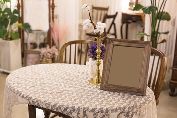 Vintage photo frame on wooden table