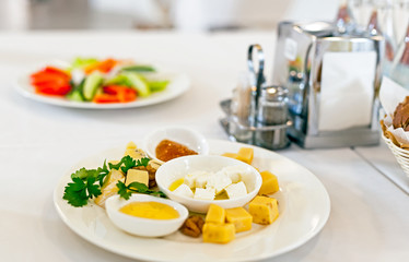 Served tables in restaurants and cafes, meals and drinks on the tables, room design.