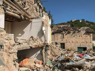 A badly damaged house in rural Italy after an earthquake, the external wall has been destroyed...