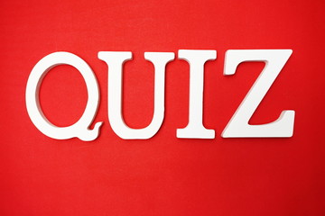 Top view Quiz letters alphabet letters on red