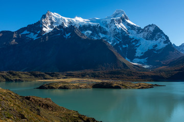 Fototapeta na wymiar A majestic lake in Patagonia with mountain range in the background, Torres del Paine, National Park, Chile, clear blue sky