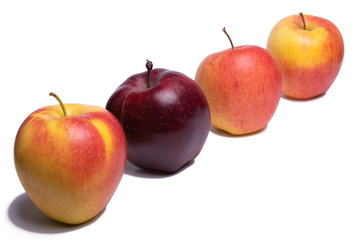 Three yellow apples and one red apple on a white background, isolated Apple. Be unique.