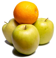 Three green apples and orange on a white background, isolated Apple. Be unique.