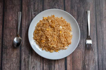 Malaysian traditional fried rice on top of porcelain plate.