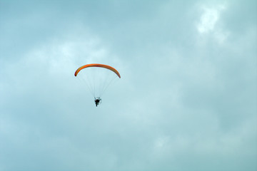 paraglider in the sky,sky, parachute, paragliding, paraglider, fly, sport, extreme,high, activity,clouds, flight, fun, wind, freedom, air, adventure, gliding