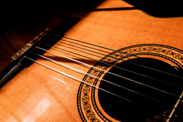 Obraz premium acoustic guitar on black background