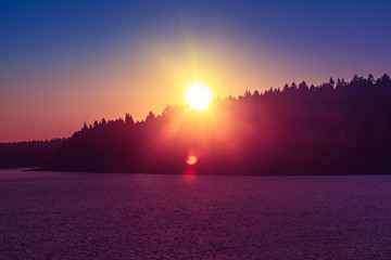 idyllic colorful sunset over a lake