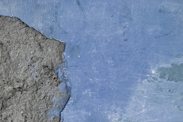 Obraz na płótnie Canvas gray and blue textured plaster on the wall