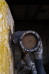 Close up of a vintage petrol pump glass measure