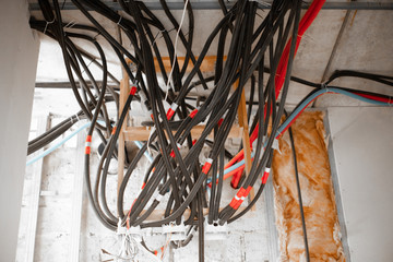 Electrical wires hanging off the ceiling