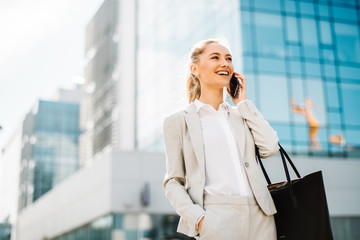 Young businesswoman on the phone. Female manager on the phone. 
