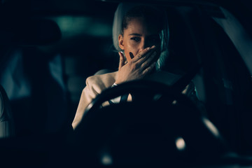 Woman annoyed in car. Girl stuck in traffic.