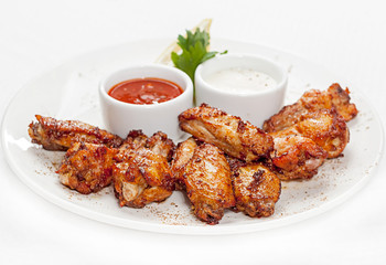 A plate with meat dishes, kebabs, bishtex, sauces and various croutons.