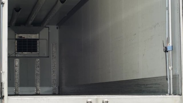 Empty truck inside waiting to fill. parallax effect. Shot on RED