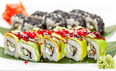 Rolls on a white plate with seasonings.