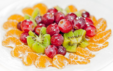 Dish with different fresh fruits.