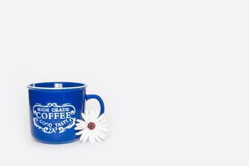 blue ceramic mug with the inscription coffee on a white background