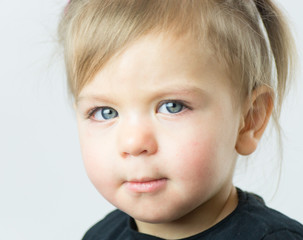 Portrait of a little girl with green eyes