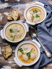 Vegetable soup with meatballs. Cabbage, potatoes, carrots and meatballs. Vertical shot