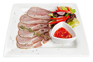 A plate with meat dishes, kebabs, bishtex, sauces and various croutons.