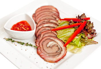 A plate with meat dishes, kebabs, bishtex, sauces and various croutons.