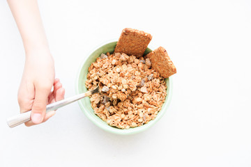 crispy muesli dry Breakfast in a bowl isolated on white background selective focus, top view