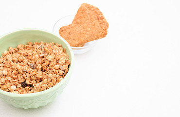 crispy muesli dry Breakfast in a bowl isolated on white background selective focus, top view