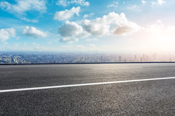 Fototapeta premium Shanghai city skyline and empty asphalt road scenery,China