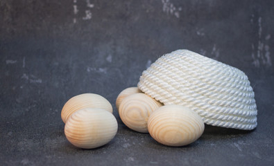 Decorative wooden Easter eggs in a wicker plate basket