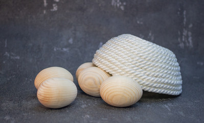 Decorative wooden Easter eggs in a wicker plate basket
