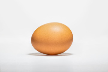 brown chicken egg isolated on white background.  brown oval chicken egg isolated on white background 