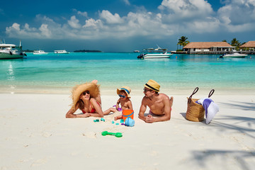 Family with three year old boy on beach