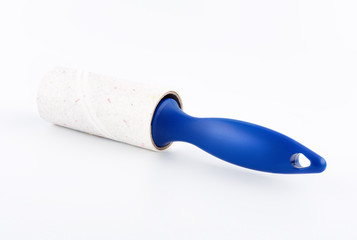 Roller cleans clothes Isolated on white background. Adhesive lint roller.