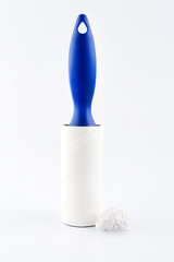 Roller cleans clothes Isolated on white background. Adhesive lint roller.