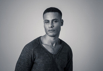 Fashion portrait of Attractive african american male model posing happy and sexy for the camera