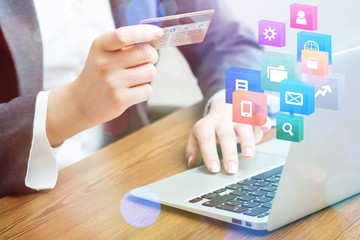 Young business man using laptop and credit card
