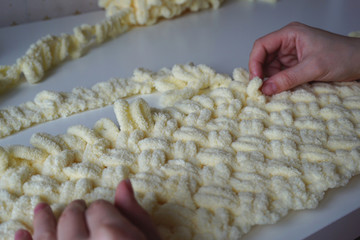 knitting a warm blanket of yarn with loops