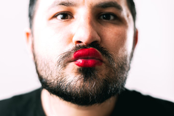 Obraz premium portrait of Bearded man with painted lips posing