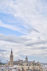Fototapeta na wymiar April 2019 - Seville SPAIN - Skyline of the city (capital of Andalusia) from the observation deck (Metropol Parasol) in a cloudy day.