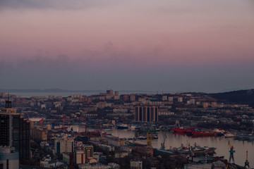 Panoramic view of the city of Vladivostok against the sunset.