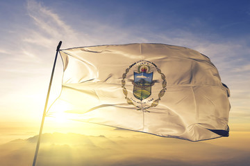 La Paz department of El Salvador flag waving on the top sunrise mist fog