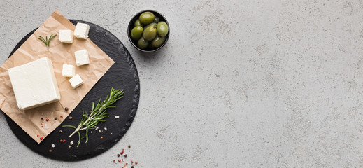 Block of butter and spices on concrete background
