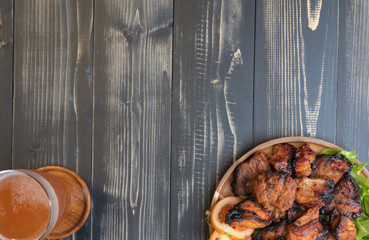 glass of beer cider and grilled pork